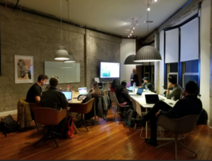 Workers collaboratively working in an office environment -enlarged.
