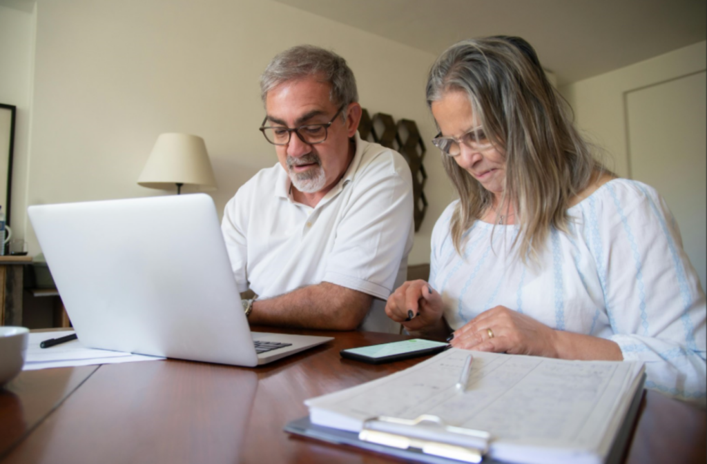 Man and woman looking at computer enlarged.