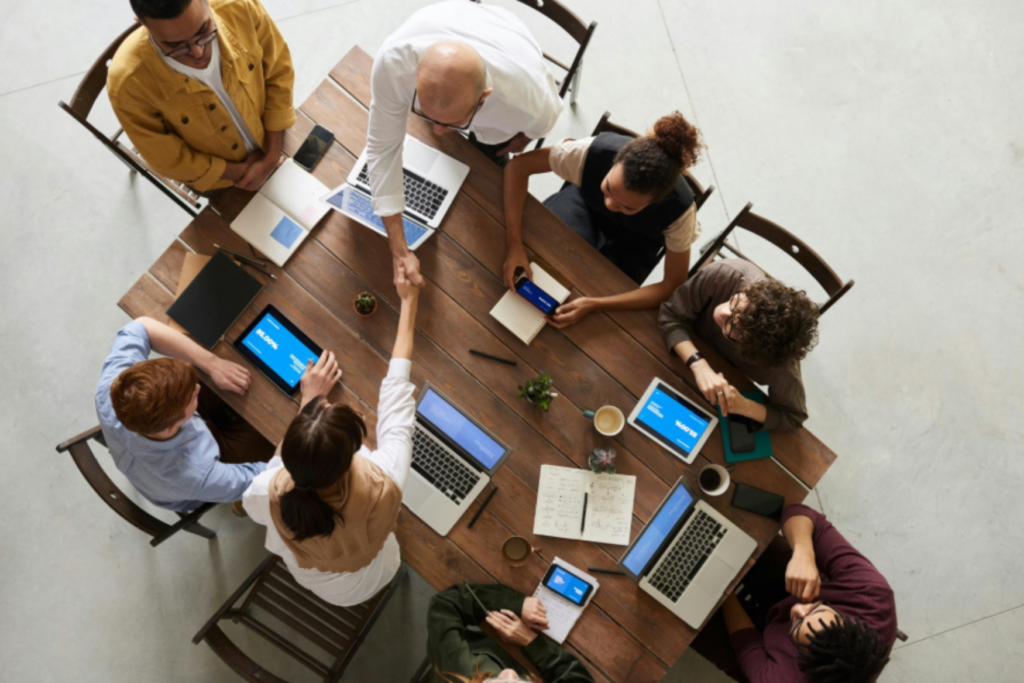 Overhead of a group of workers working together enlarged.