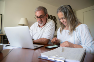 Man and woman looking at computer.