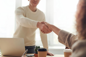 Two workers shaking hands.