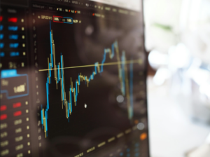 Up close picture of a screen showing the trajectory of a stock.