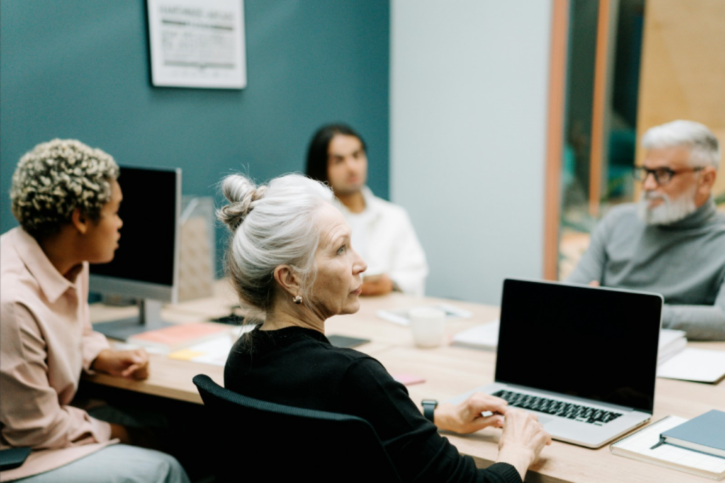 Group of coworkers participating in a meeting. - Enlarged